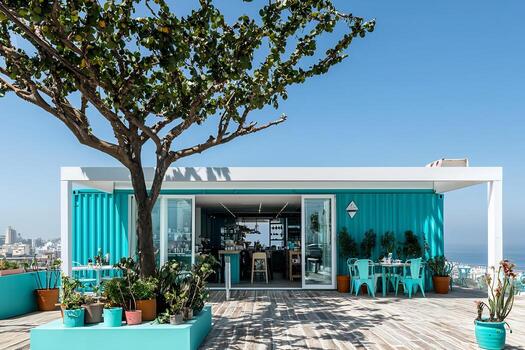 colorful-repurposed-shipping-container-cafe-or-retail-pop-up-with-outdoor-patio-seating-and-lush-landscaping-in-urban-setting-photo.jpeg